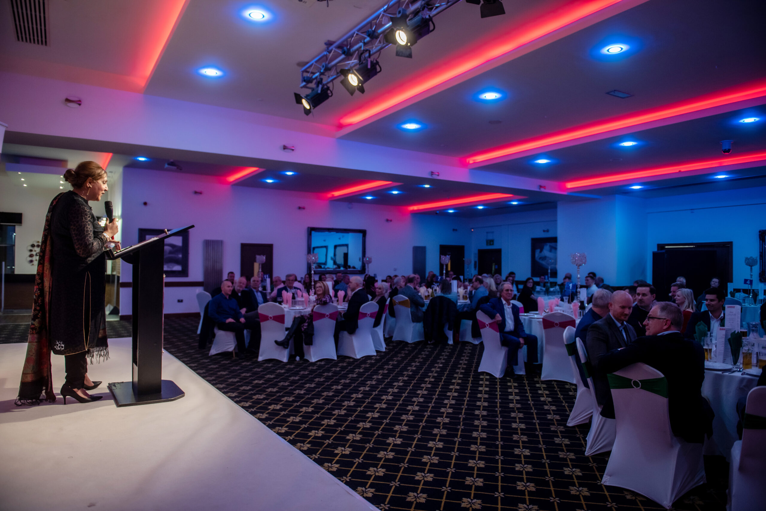 Fara Butt talking to guests at the 2022 Yorkshire Curry Night